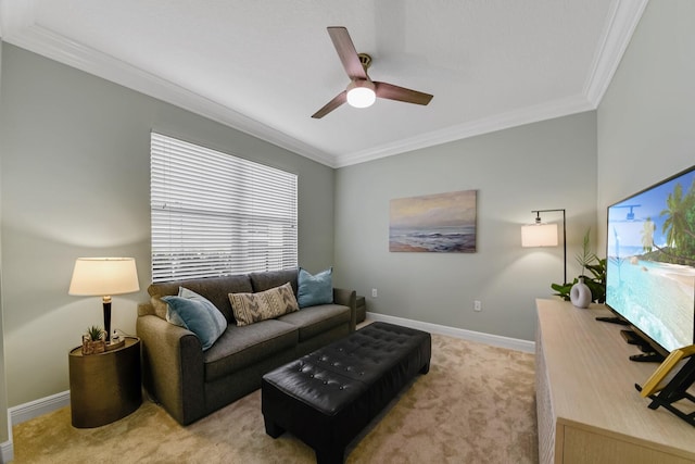 carpeted living room with ceiling fan and crown molding