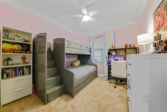 carpeted bedroom featuring crown molding and ceiling fan