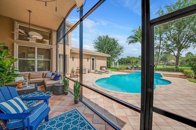 view of swimming pool featuring a patio area, ceiling fan, and an outdoor hangout area