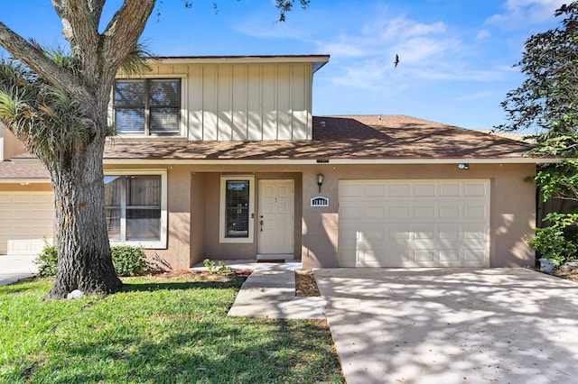 view of front of property featuring a garage and a front lawn