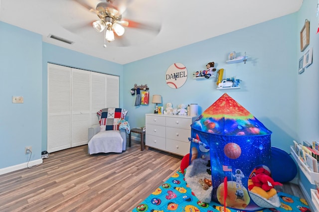 recreation room with hardwood / wood-style flooring and ceiling fan