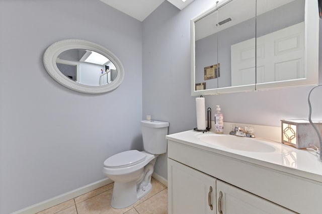 bathroom featuring tile patterned floors, vanity, and toilet