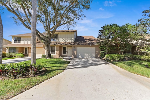 view of front of property featuring a garage and a front yard