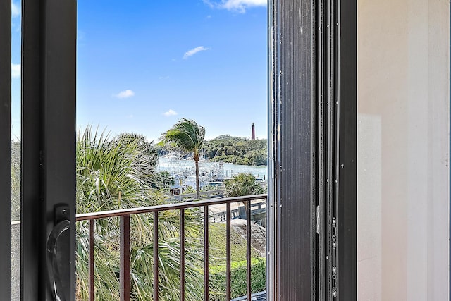 balcony featuring a water view