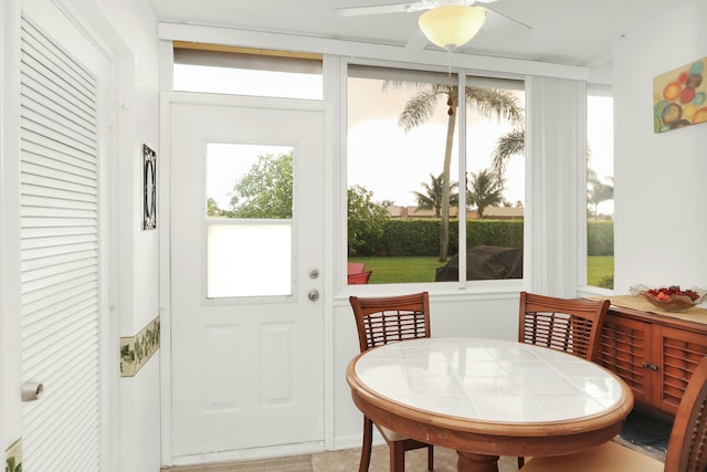 sunroom / solarium with ceiling fan