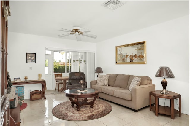 tiled living room featuring ceiling fan