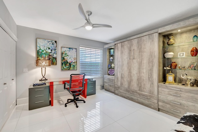 office with tile patterned floors and ceiling fan