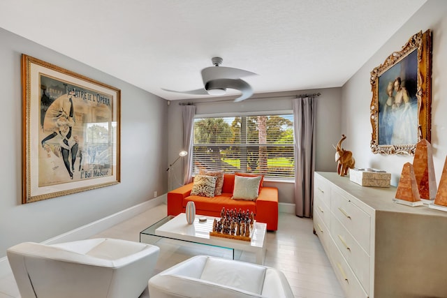 living area featuring ceiling fan