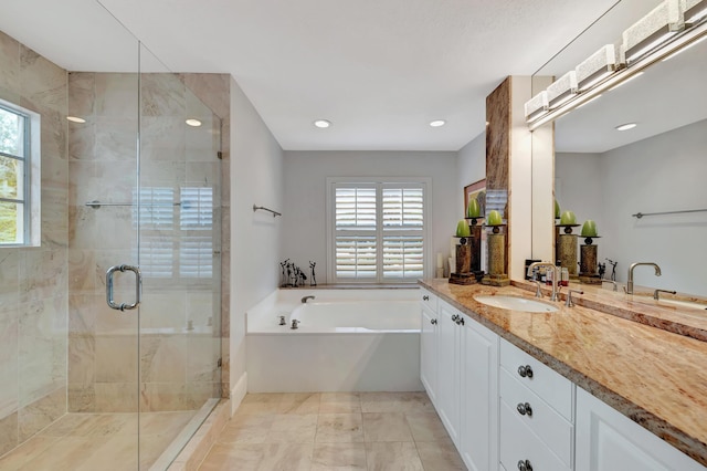 bathroom featuring plus walk in shower and vanity