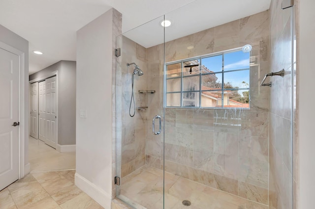 bathroom with a shower with shower door