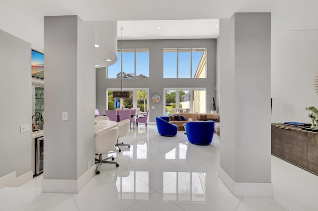 tiled office space featuring beverage cooler