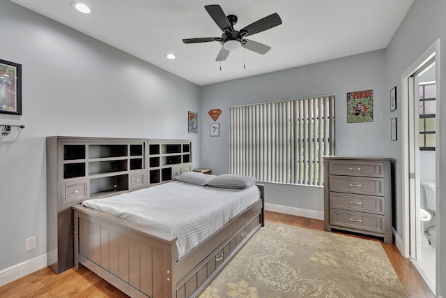 bedroom with ceiling fan and light hardwood / wood-style flooring