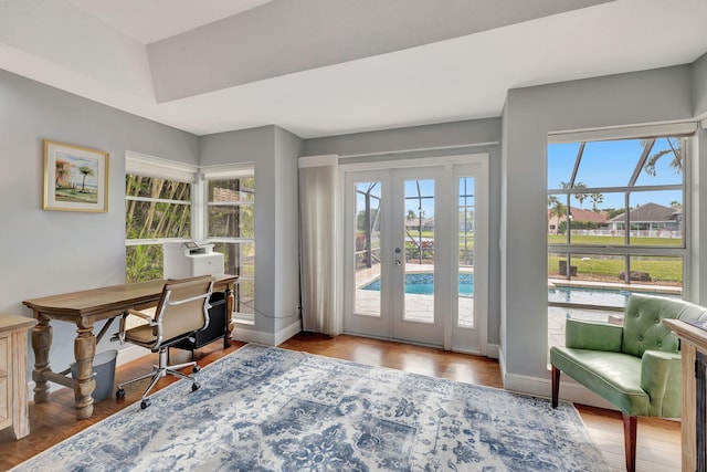 office space featuring french doors and hardwood / wood-style flooring