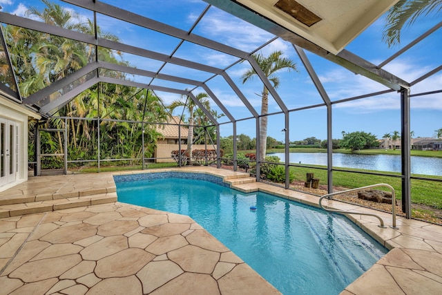 view of swimming pool with a lanai, a water view, a yard, and a patio