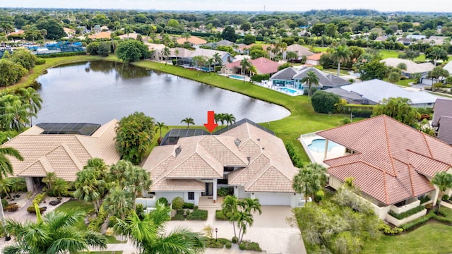 birds eye view of property with a water view