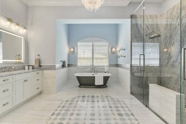 bathroom featuring separate shower and tub, vanity, tile walls, and a chandelier