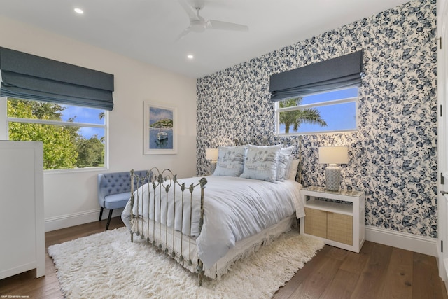 bedroom featuring ceiling fan and dark hardwood / wood-style floors