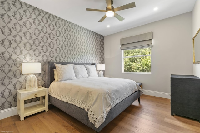 bedroom featuring ceiling fan and hardwood / wood-style flooring