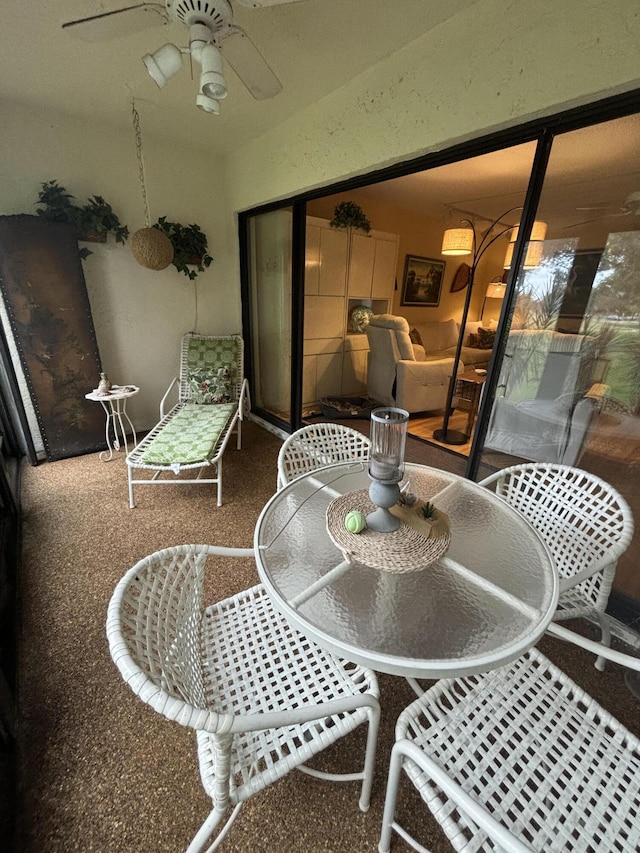 sunroom / solarium with ceiling fan