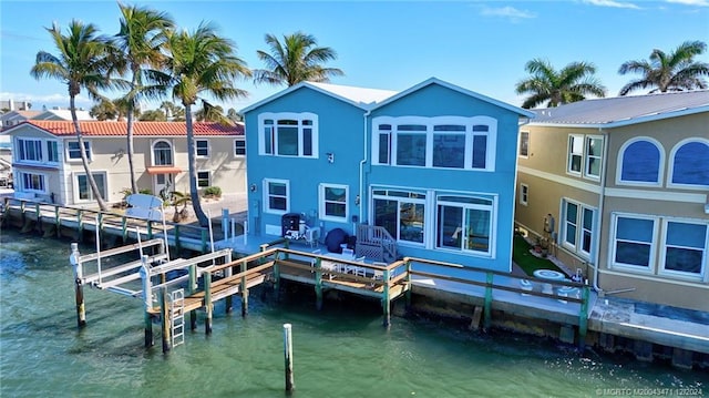 rear view of house with a water view