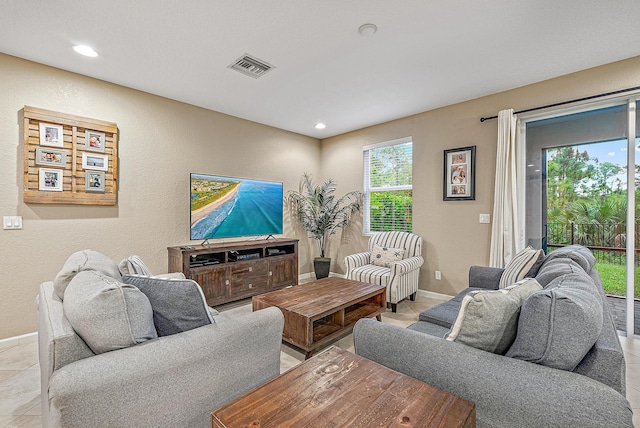 living room with light tile patterned flooring