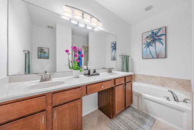 6070 SE Split Oak Trl, Hobe Sound, FL 33455 - bathroom featuring double vanity, a garden tub, and tile patterned floors