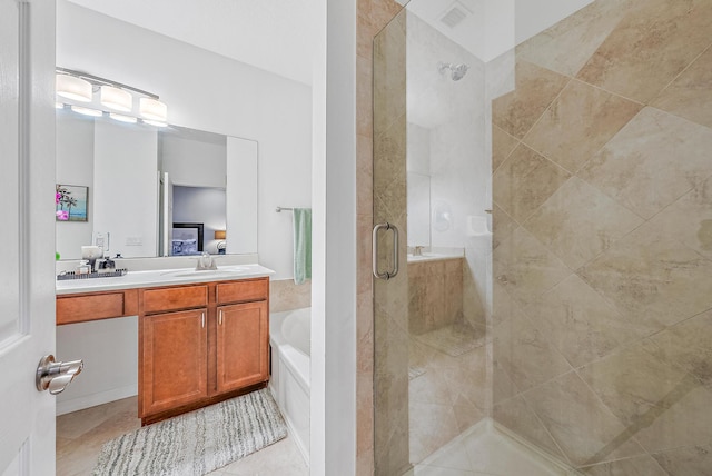 bathroom featuring vanity and separate shower and tub