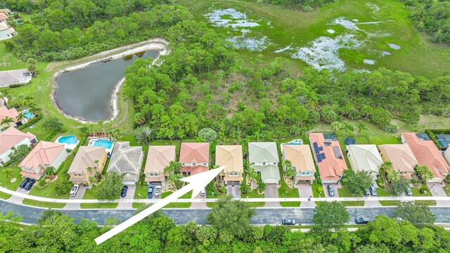 6070 SE Split Oak Trl, Hobe Sound, FL 33455 - aerial view of property and surrounding area with a large body of water and nearby suburban area