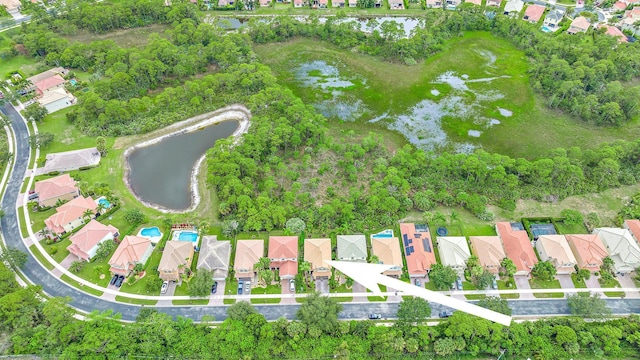 6070 SE Split Oak Trl, Hobe Sound, FL 33455 - aerial view of property and surrounding area with a large body of water and nearby suburban area