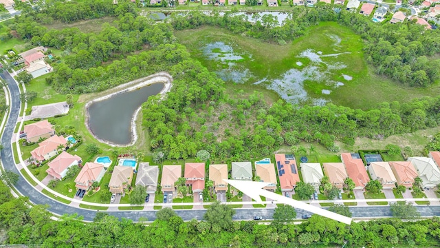 bird's eye view with a water view