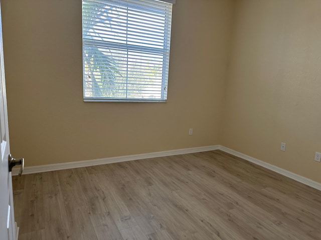 empty room with light wood-type flooring