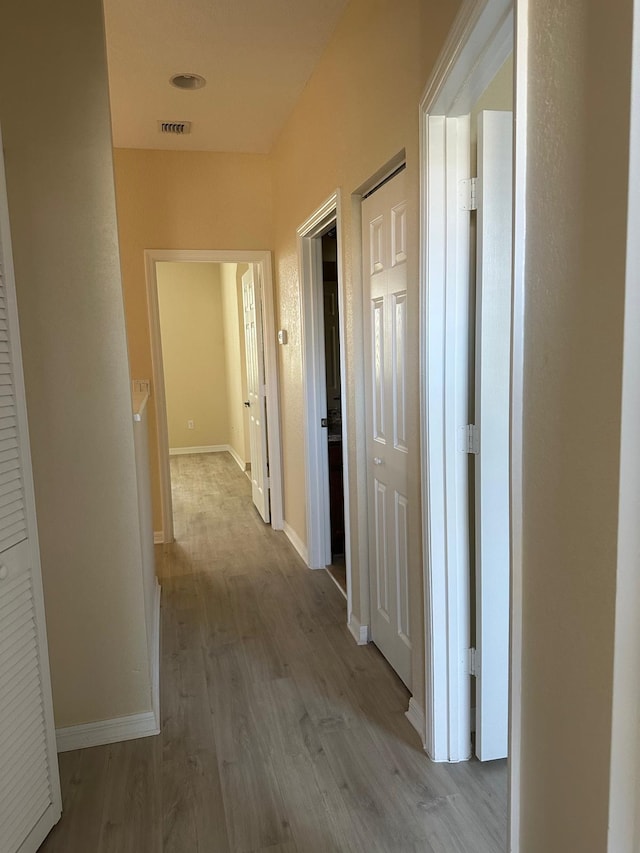 hallway with light wood-type flooring