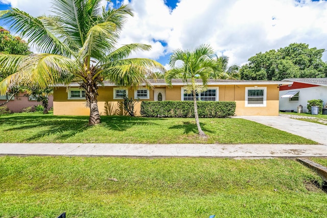 ranch-style home with a front lawn