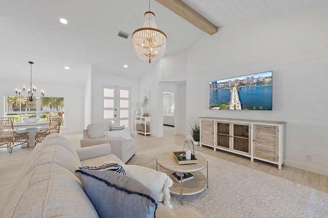 living room with french doors, light wood-type flooring, high vaulted ceiling, a notable chandelier, and beamed ceiling