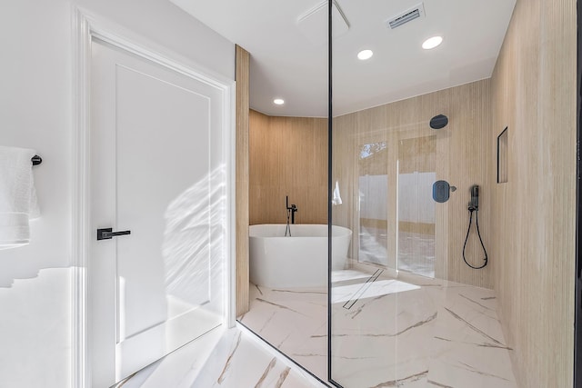 bathroom with shower with separate bathtub