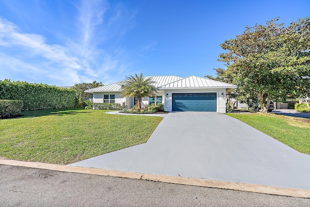 view of front facade featuring a garage and a front lawn