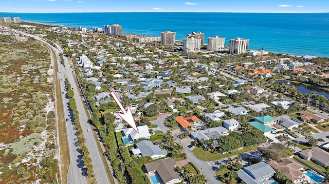 birds eye view of property featuring a water view