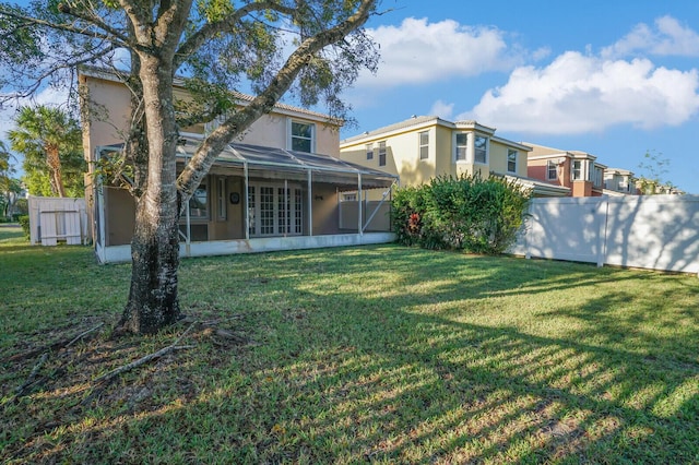 view of yard featuring a sunroom