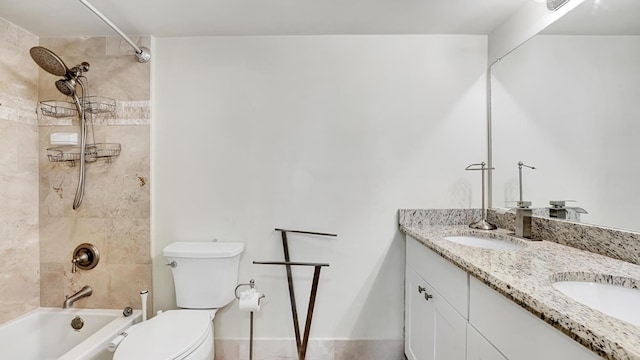 full bathroom with vanity, toilet, and tiled shower / bath combo