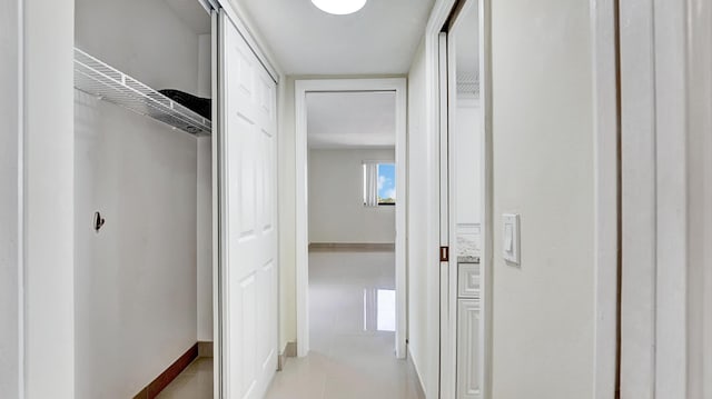 hallway featuring light tile patterned flooring