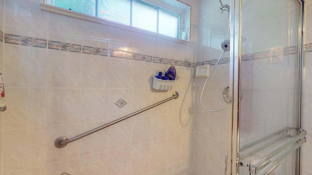 bathroom with a tile shower