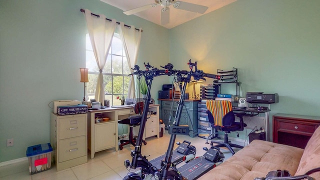 tiled office with ceiling fan and a healthy amount of sunlight