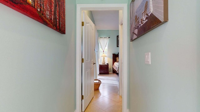 corridor with light tile patterned floors