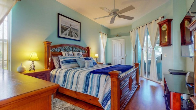 bedroom featuring ceiling fan and dark wood-type flooring