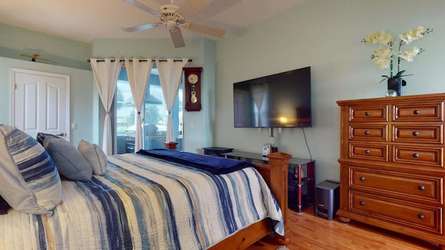 bedroom with access to outside, ceiling fan, and light hardwood / wood-style flooring