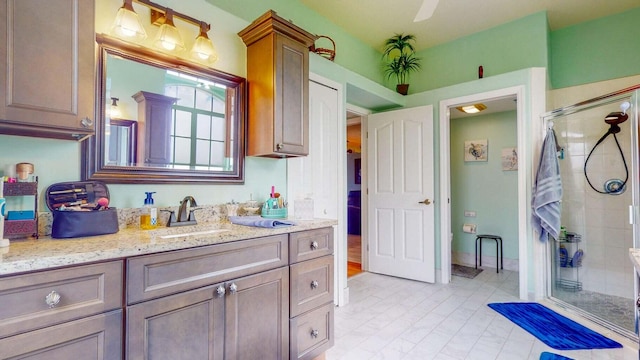 bathroom with vanity and walk in shower