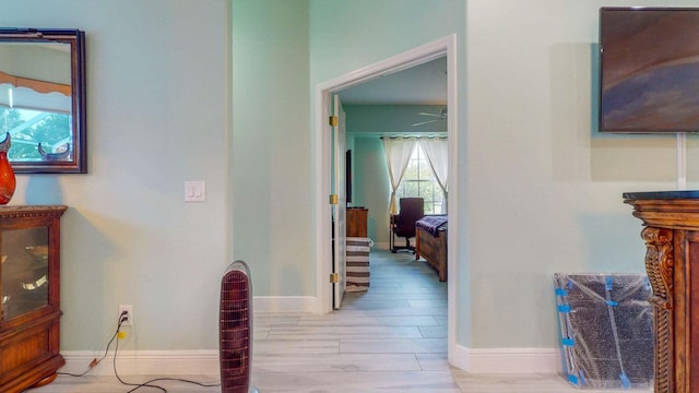 hall with light hardwood / wood-style floors