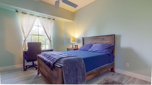 bedroom with ceiling fan and light hardwood / wood-style floors