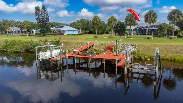 dock area with a yard and a water view