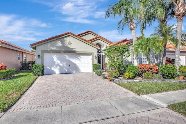 mediterranean / spanish-style house with a garage